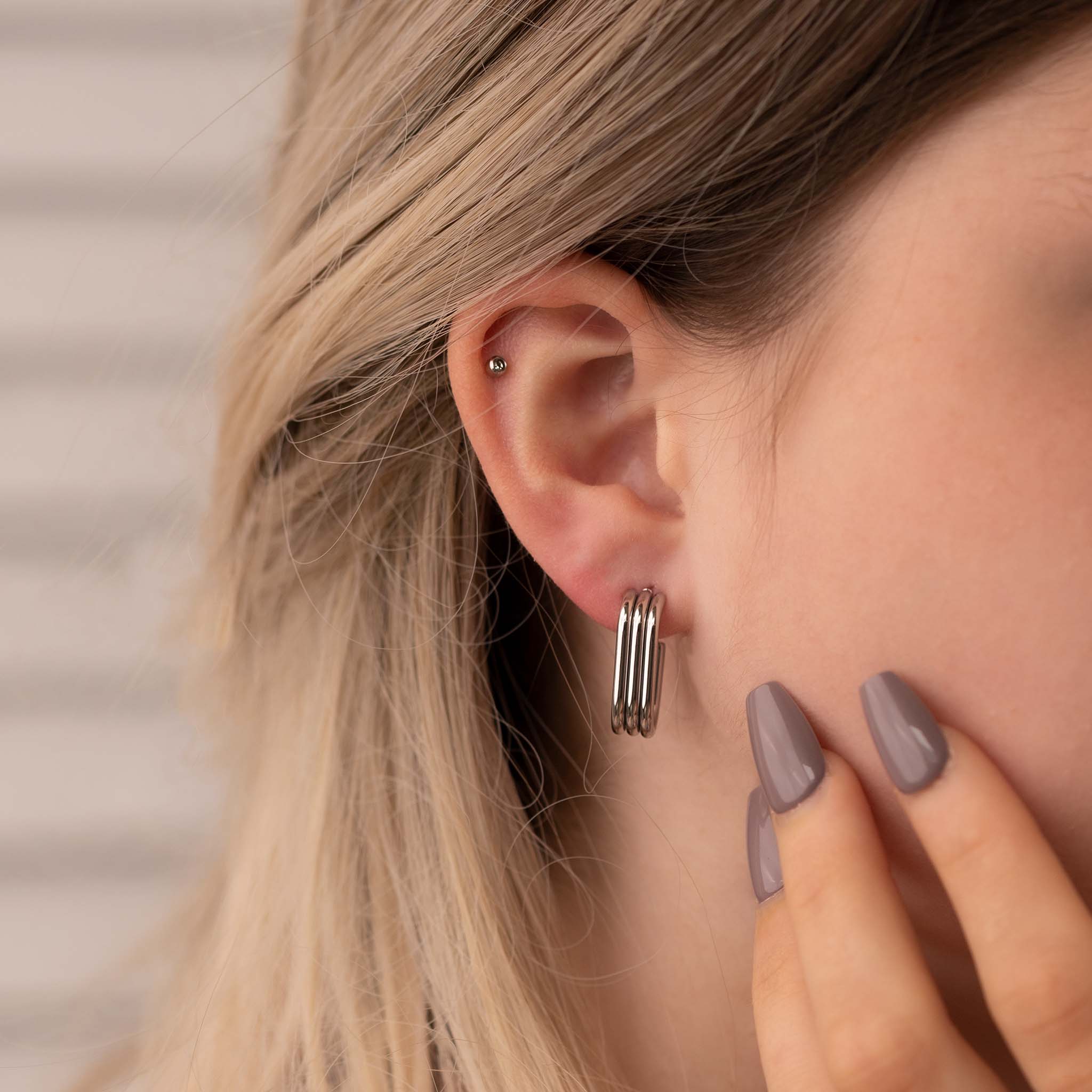 Boucle d'oreille Trinix argentée