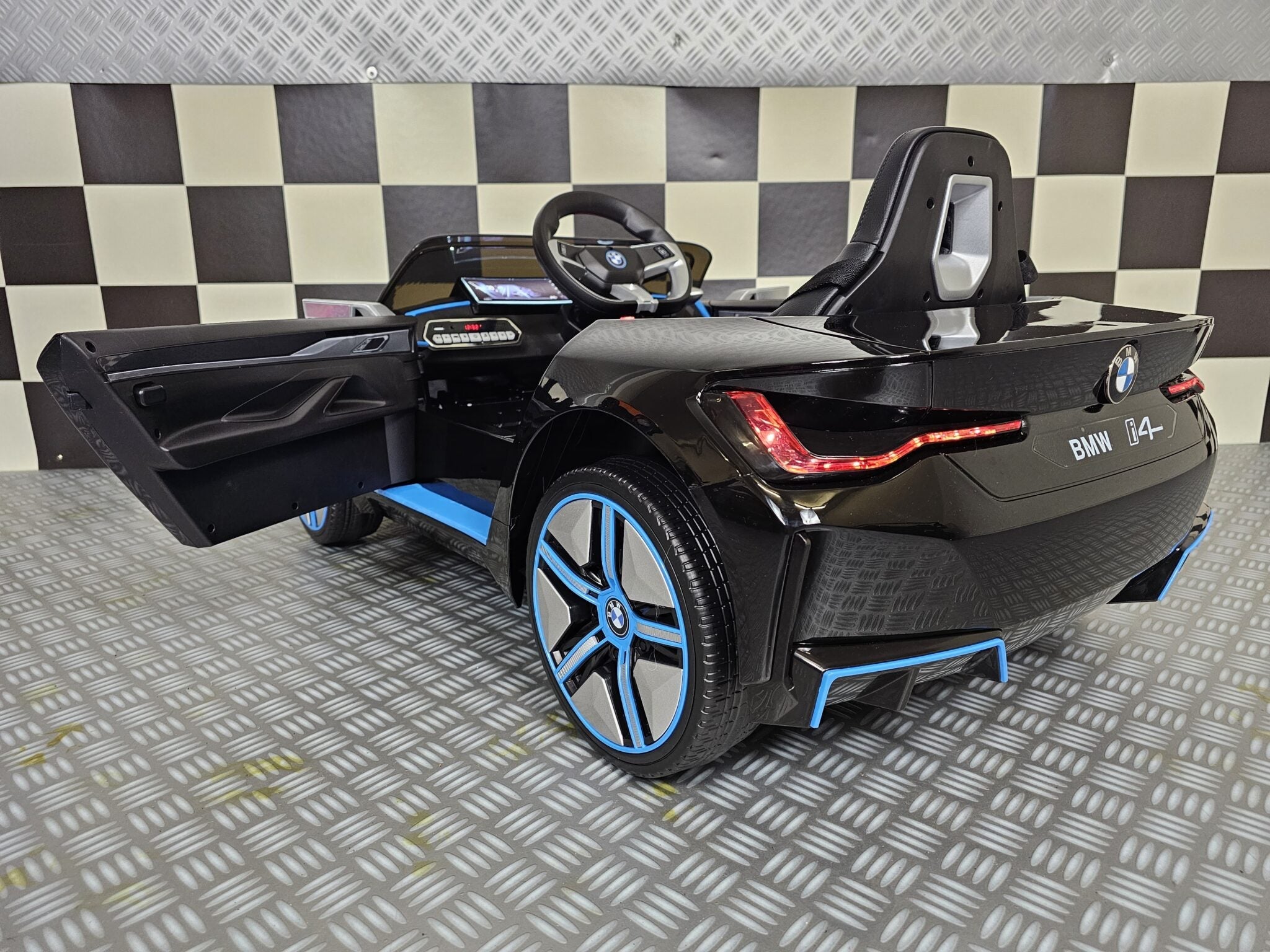 Elektrische kinderauto BMW i4 12 volt zwart