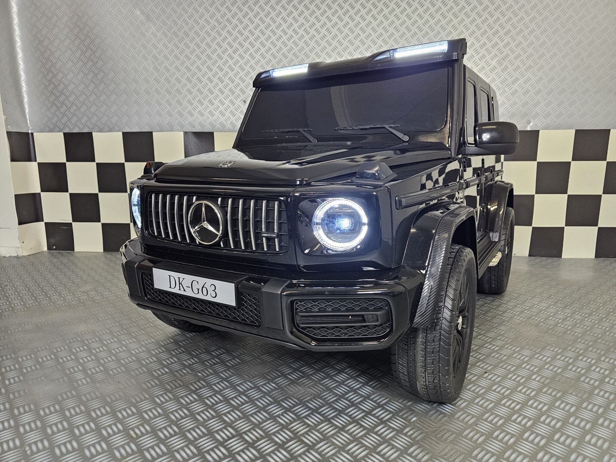 Elektrische kinderauto Mercedes G63 AMG 4×4 24 volt 2-persoons metallic zwart